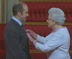 Receiving my MBE from HRH Queen Elizabeth II 
